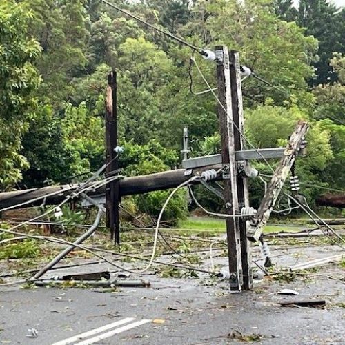 Power pole on the ground with severe damage