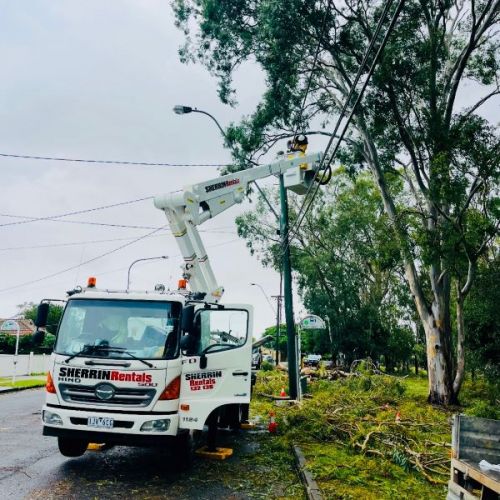 Crews working in a cherry picker on powerlines