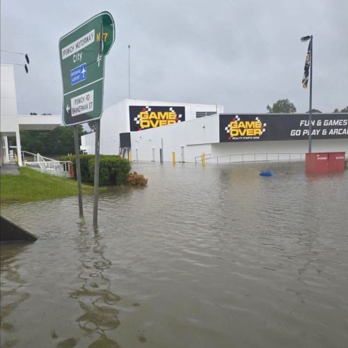 Flood water over roads and arcade at Oxley