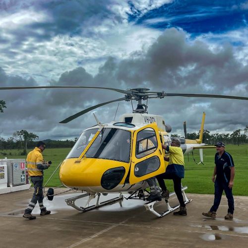 Workers boarding a helicopter on the tarmac