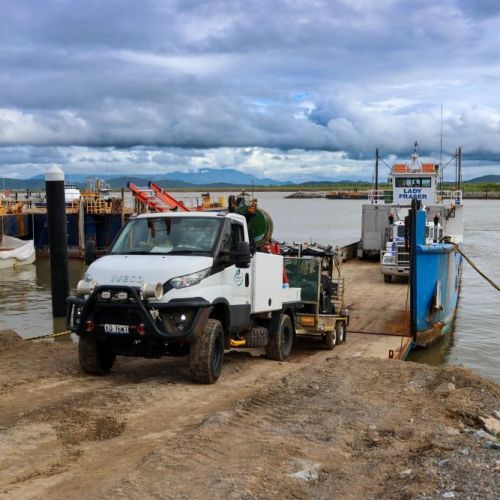 Vehicles disembarking a barge at Lucinda