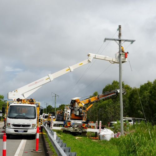 Crews working up a power pole at Ollera Creek