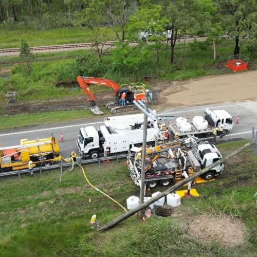 Aerial view of power pole on the ground at Ollera Creek