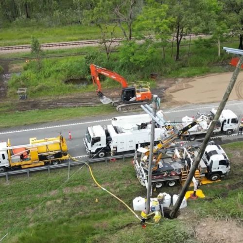 Aerial view of power pole nearly installed at Ollera Creek