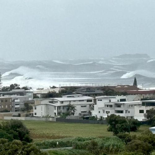 Houses on the coast at Kingscliff with high sea swells