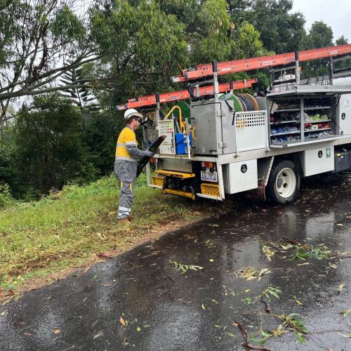 Crews working on the road with vehicle in Brendale