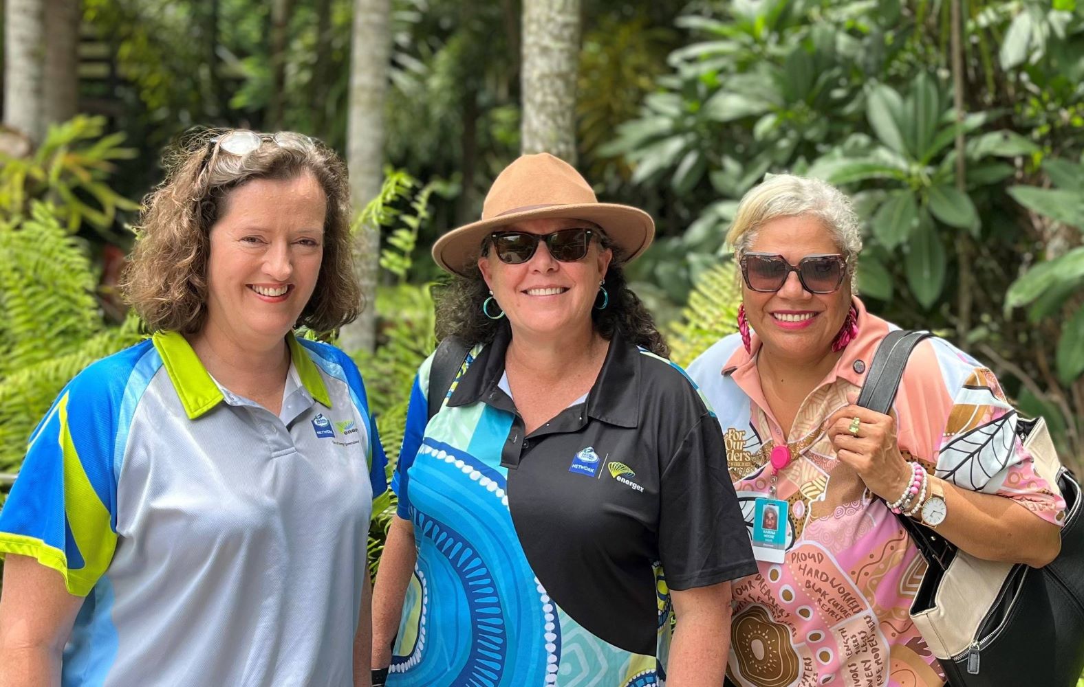 The community engagement team in front of the rainforest