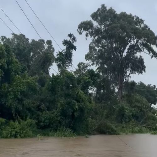 Flooded streets in Ingham - powerlines in the water