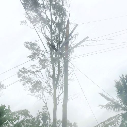 Damage to the top of a power pole after severe weather