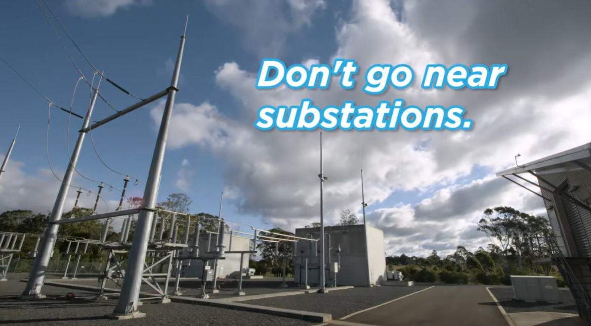 A substation with a barbed wire fence around it